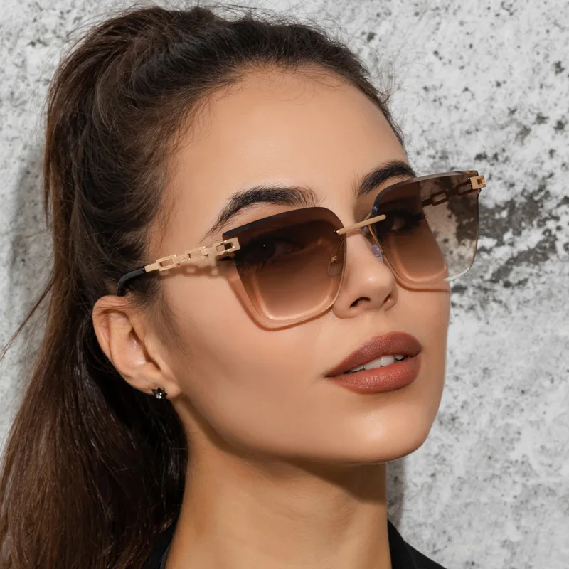 

New fashion rimless cut edge sunglasses men's and women's metal hollowed out progressive color shades ocean piece glasses