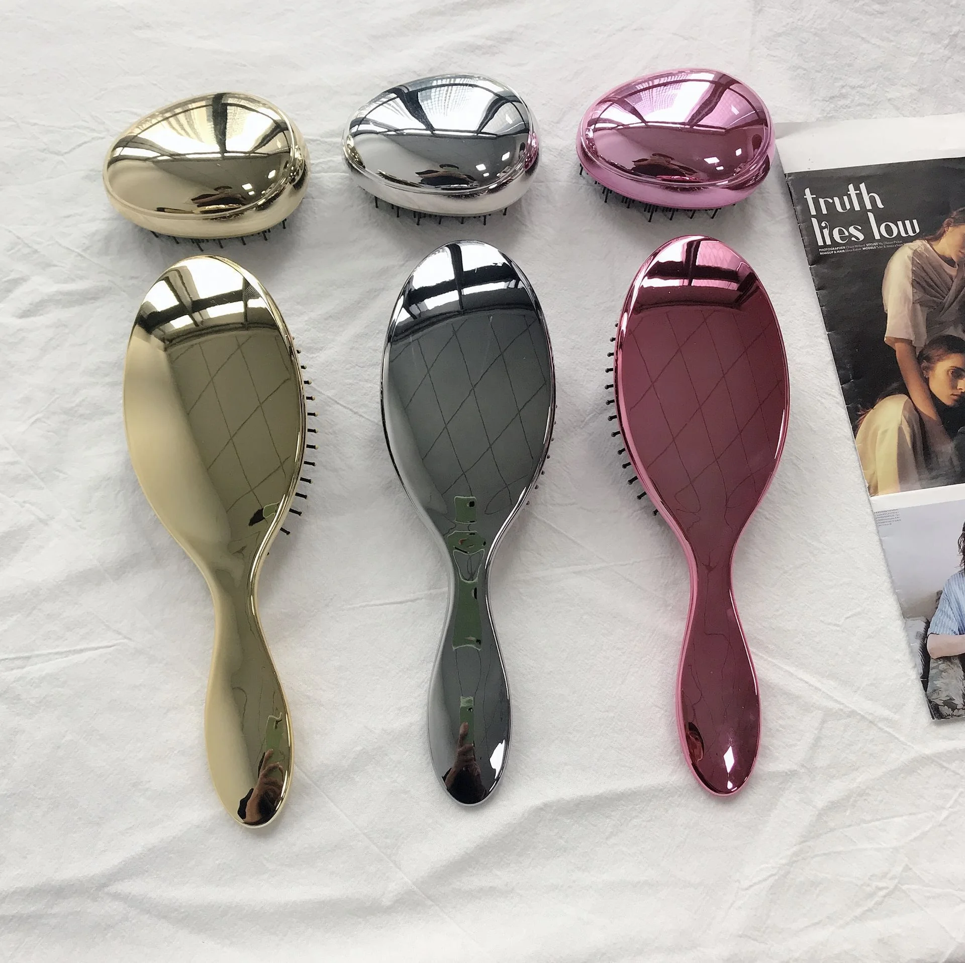 

New arrival China hot selling private label plastic rose gold custom logo electroplating paddle air cushion hair brush