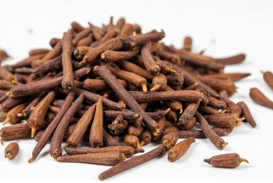 Whole cloves in a wooden bowl