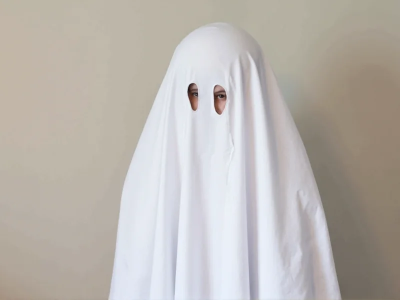 Simple ghost costume made from bedsheet with hand-cut eye holes