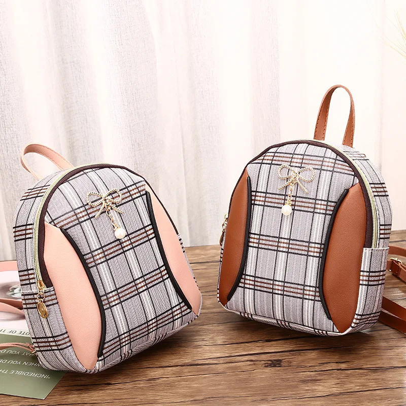 

Female bag 2020 new hit color pearl bow small backpack fashion casual one-shoulder mobile phone bag gift bag