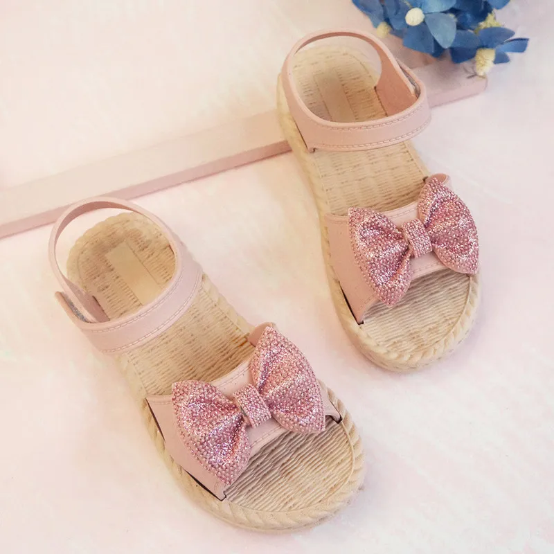 

Hot Selling Girls Jelly Bottom PVC Summer Beach Flat Sandals Bow Up Little Kids Outdoor Party Shiny Sandals