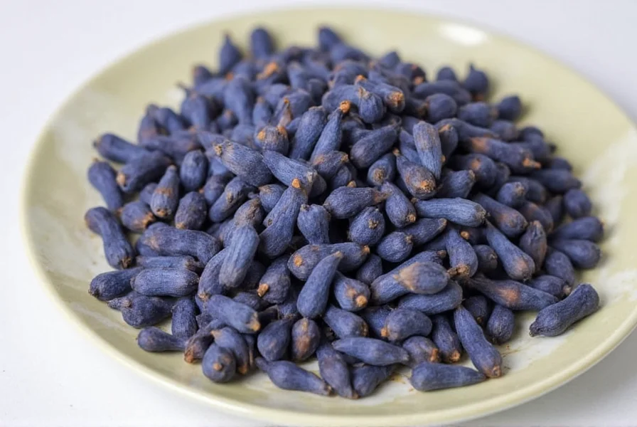 Close-up of genuine dried cloves showing their natural reddish-brown color