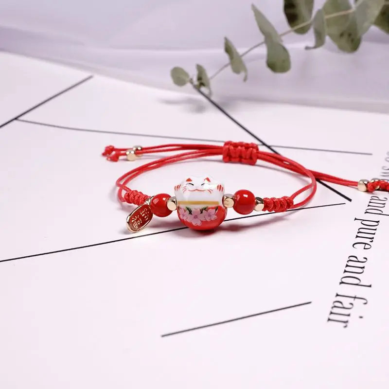 

fashion trendy jewelry lucky maneki neko rope ceramic red lucky cat bracelet