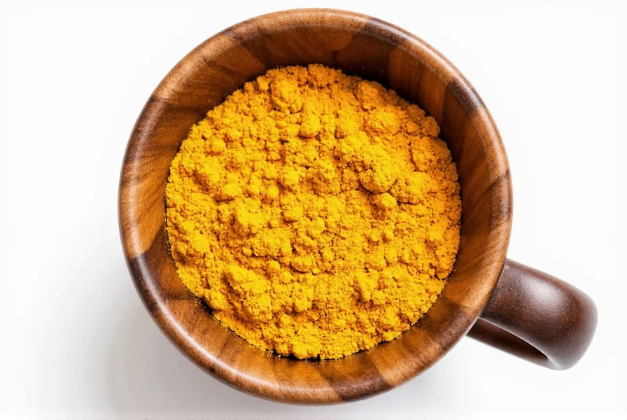 Golden turmeric coffee served with cinnamon stick and fresh turmeric root