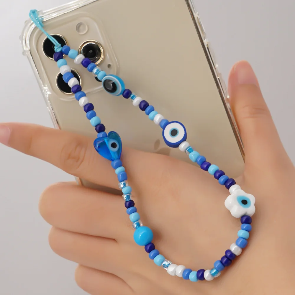 

2022 Printed mobile phone lanyard 12mm white glaze eyes heart blue glass rice beads wrist mobile phone chain female