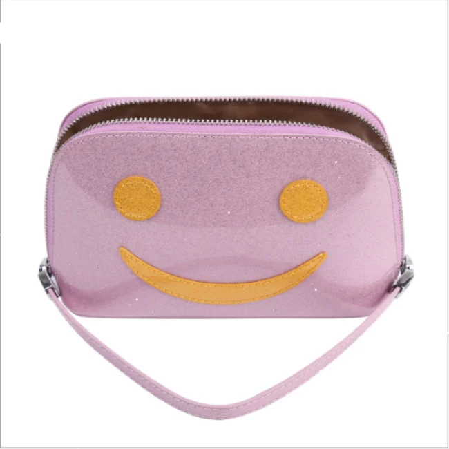 

Stock waterproof sparking magic color cosmetic bag for travel with handle Smile makeup bag, Picture
