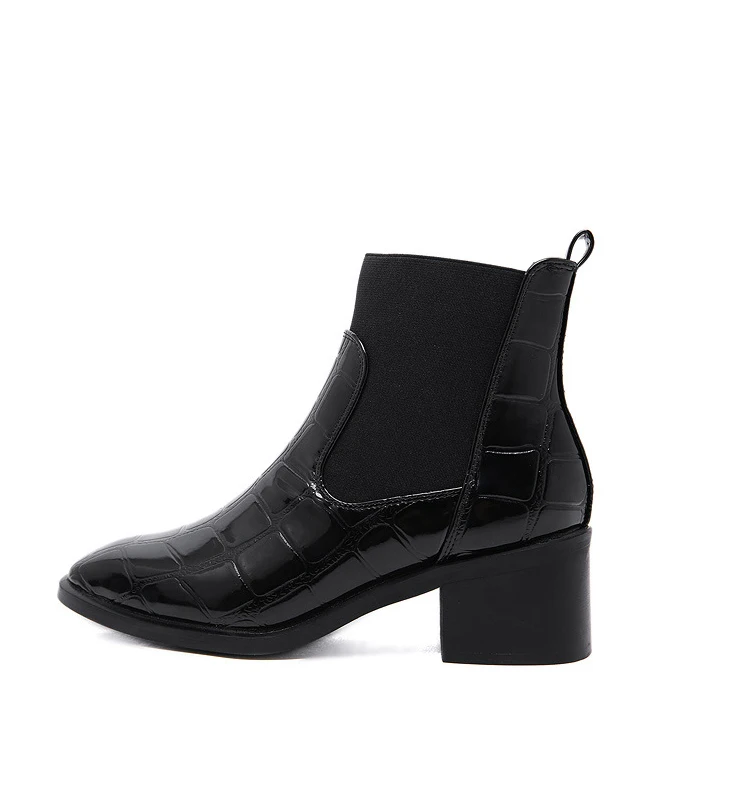 

Chic crocodile-print women's Chelsea ankle boot is chunky with Martin boot