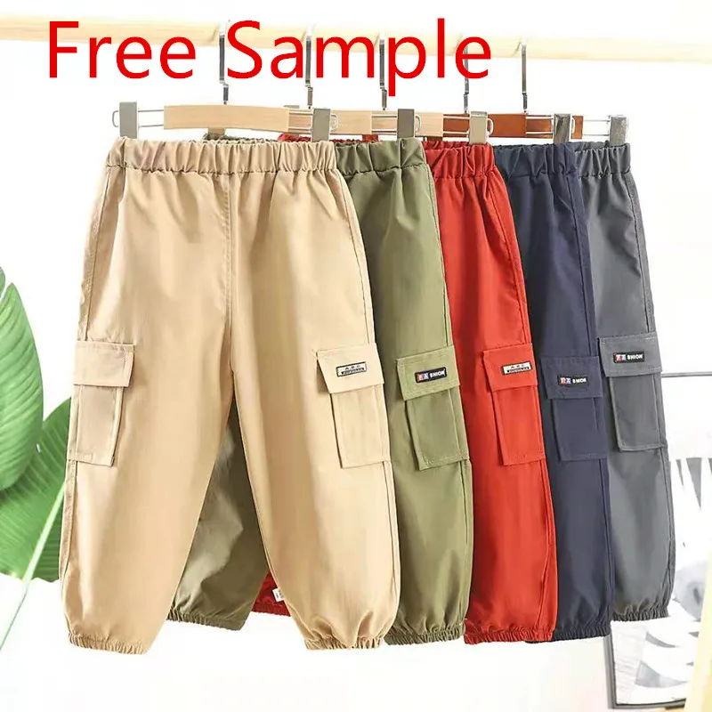 

spring Cheap wholesale solid color sports overalls kids pocket pants wear-resisting Loose style Boy's trousers