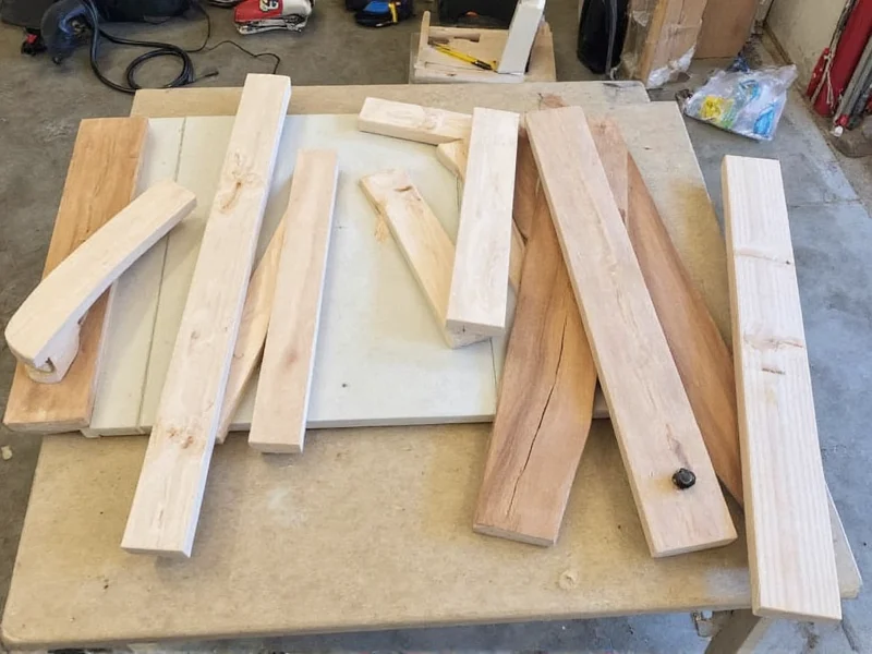 Materials for DIY miter saw table laid out on garage floor