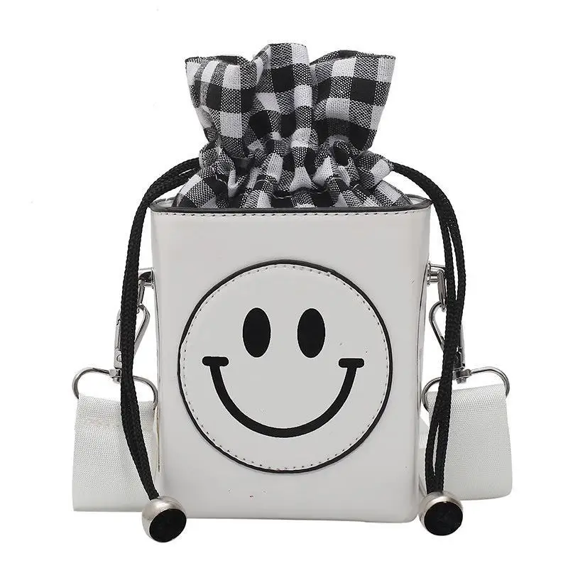 

In the summer of 2021, the new fluorescent smiling face bucket bag is a wide-band messenger bag for children