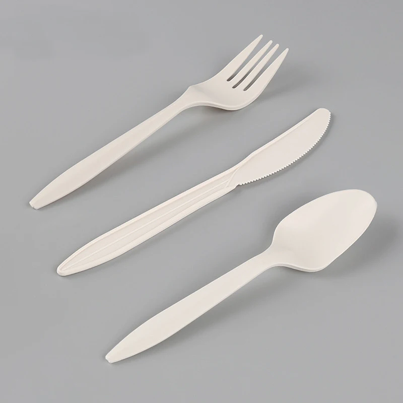 

Corn starch based spoon and fork biodegradable compostable disposable plastic cutlery set in cornstarch