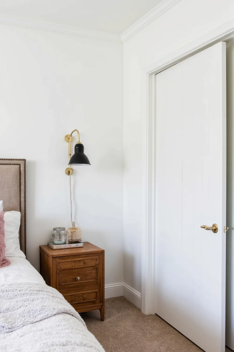 Adjustable arm wall sconce in a reading nook