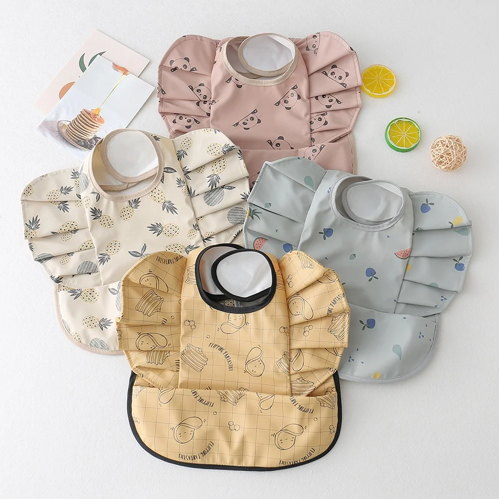 

Ins Nordic Style Baby Waterproof PU Bib Angel Wing Bib with Pocket All-Match Decoration Wave Point Bib