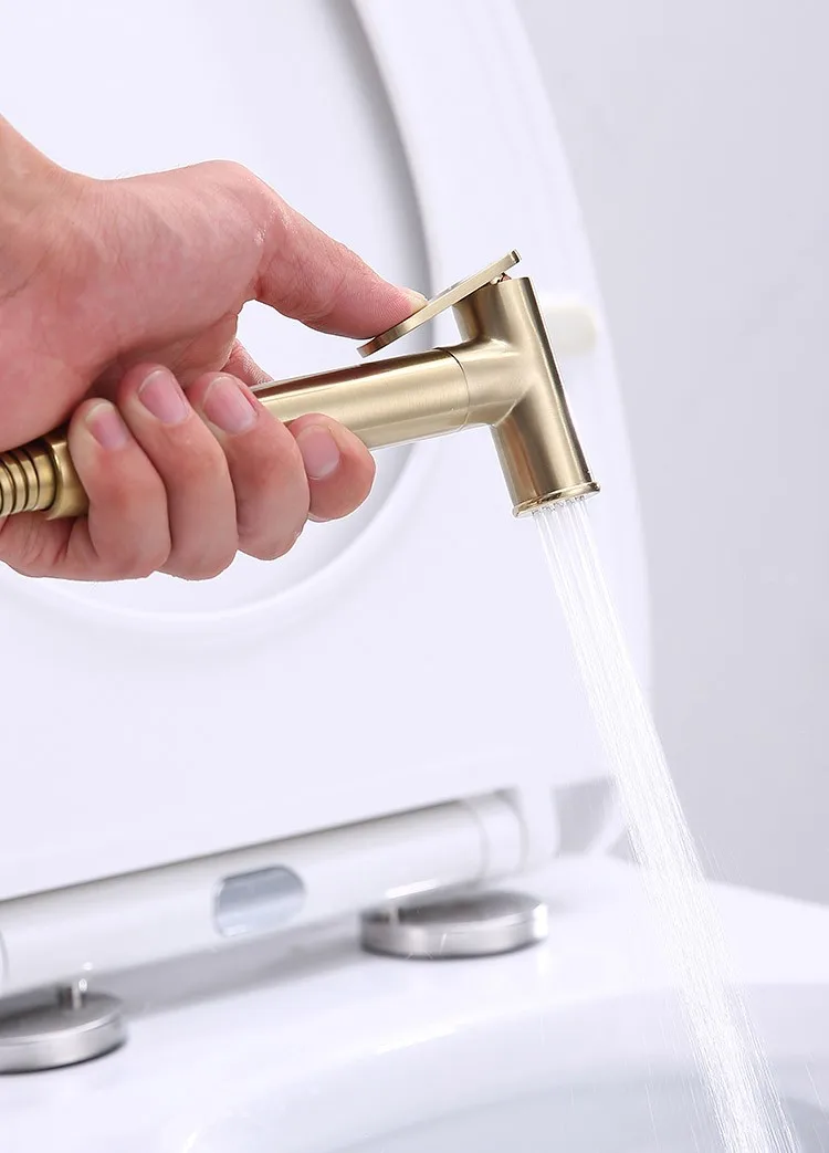 product-1-1 gold-bidet-spray-083-brushed-gold-handheld-spray-water-flow-toilet-bowl-in-use