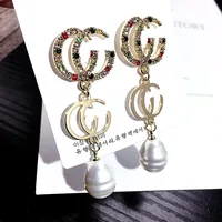 

Korean version of the new letter personality wild full diamond pearl earrings for round face earrings ZA098