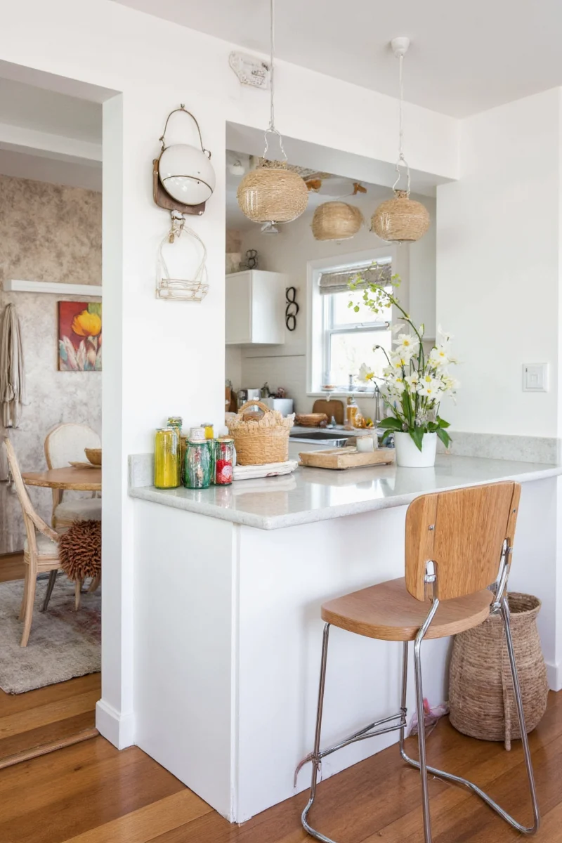 Small kitchen before renovation showing cluttered countertops