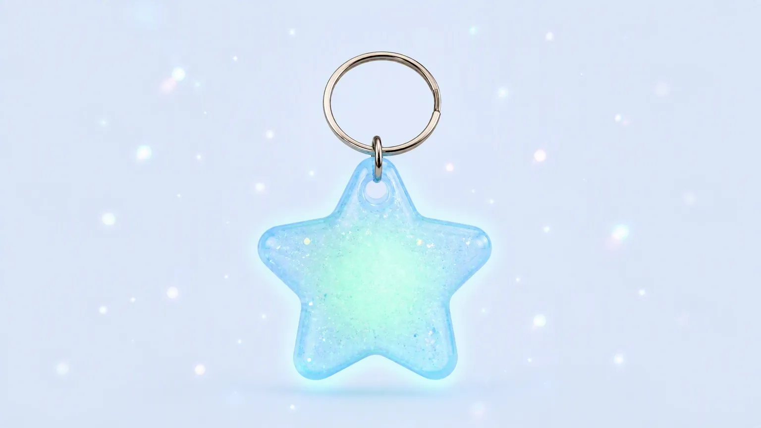 Star keychain with dreamy bokeh sparkles background