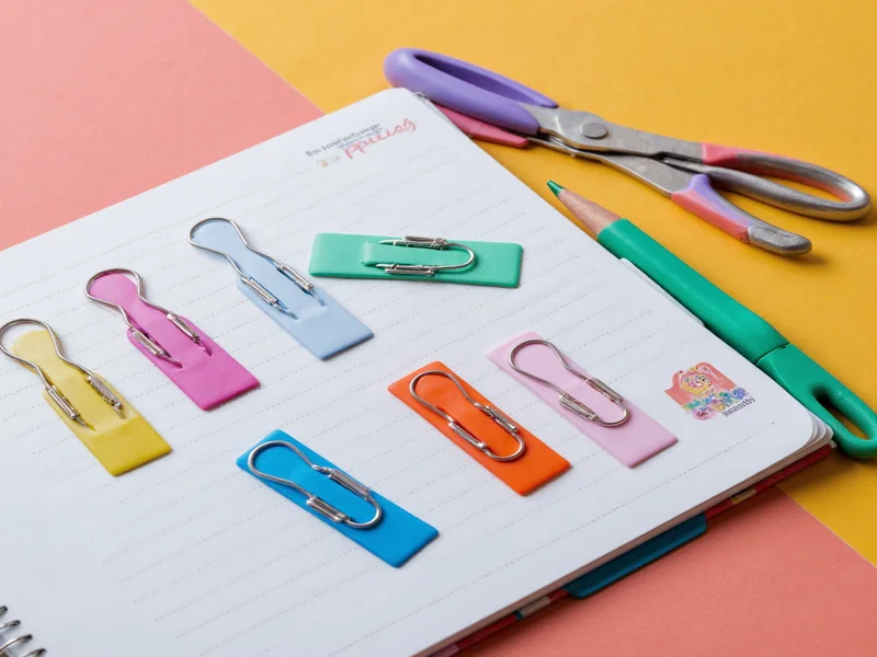 Colorful paper clip bookmark made from office supplies