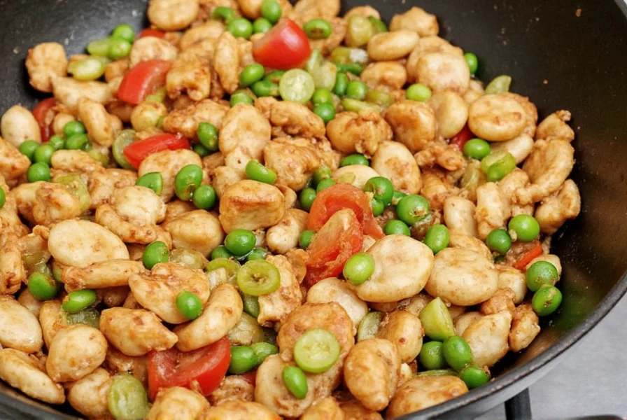 Stir-frying vegetables with fresh ginger in carbon steel wok showing proper oil temperature