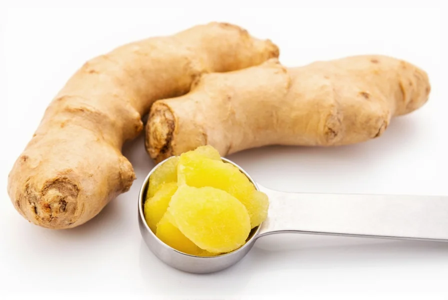 Fresh ginger root with measuring spoon showing one tablespoon portion