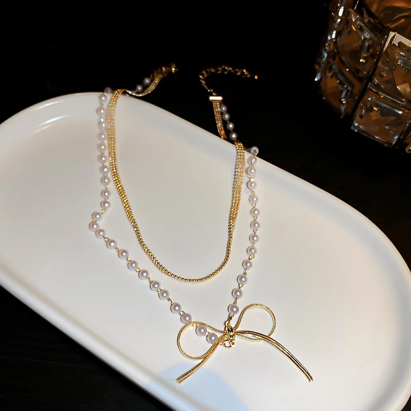 

fashion trendy bowknot pearl two layered necklace gold plated