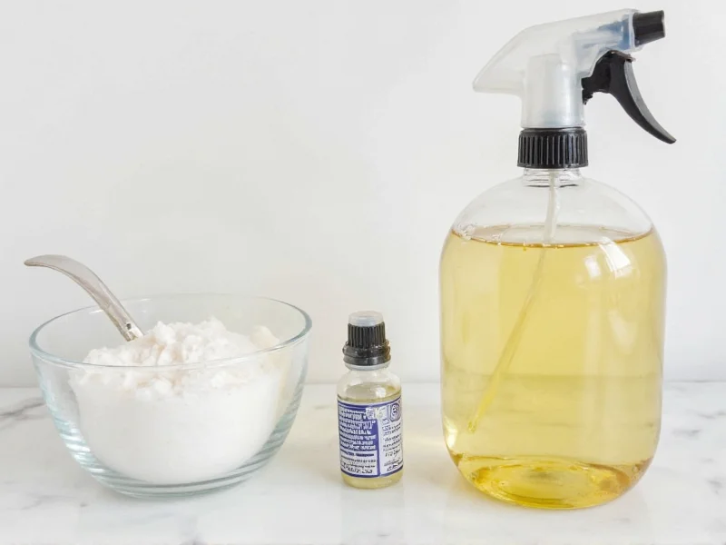 DIY window cleaner ingredients in glass spray bottle