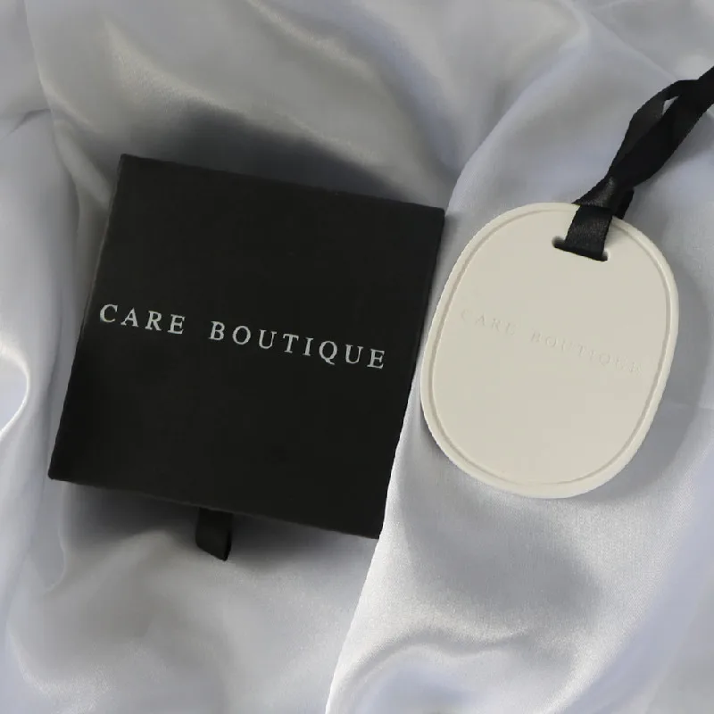 

Laser Engraved Customized Logo Hanging Oval Ceramic Aromatherapy Essential Oil Stone Diffuser, White