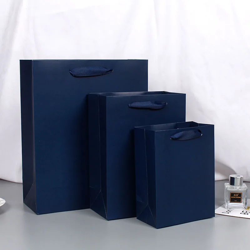 Wholesale Paper Shopping Bag With Foil Hot Stamped White Cardboard Paper Bag Manufacturers