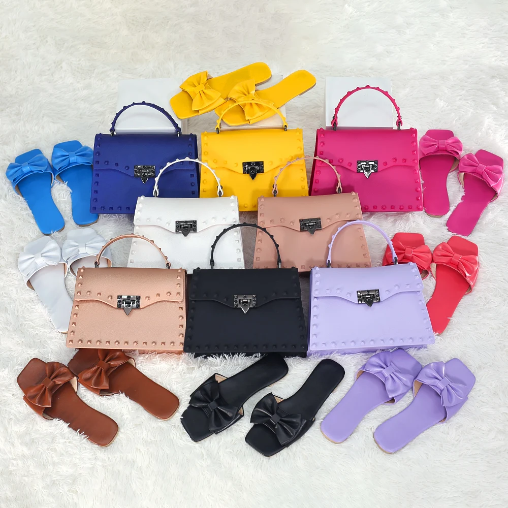 

Wholesale 2021 New Personalized PVC Jelly Bag Rivet Handbags Ladies Crossbody Women Hand Bags Purse And Bow Flat Sandals Set, 8 colors