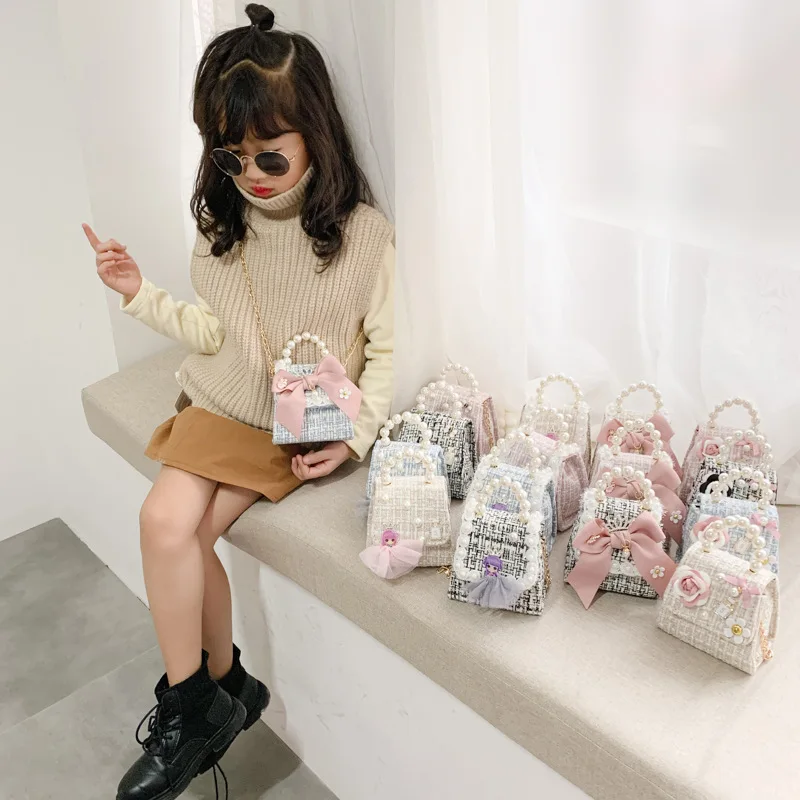 

Girls handbag kids pearl handle cotton and linen material cute doll and flower decoration kids handbags for girls