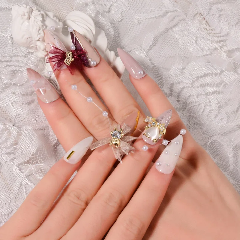 

Wholesale Luxury Cubic Zircon White Pearl 3D Nail Arts decorated gold plated Lace Bowknot Crown Fashion Heart Bear Nail Sticker