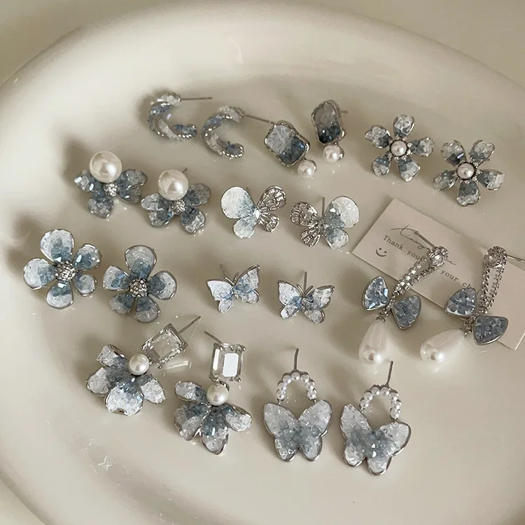 

2023 Wholesale Fashion Multiple Designs Blue Gradient Crystal Zircon Earrings Bow Flower Earrings Drop Pearl Butterfly Earrings