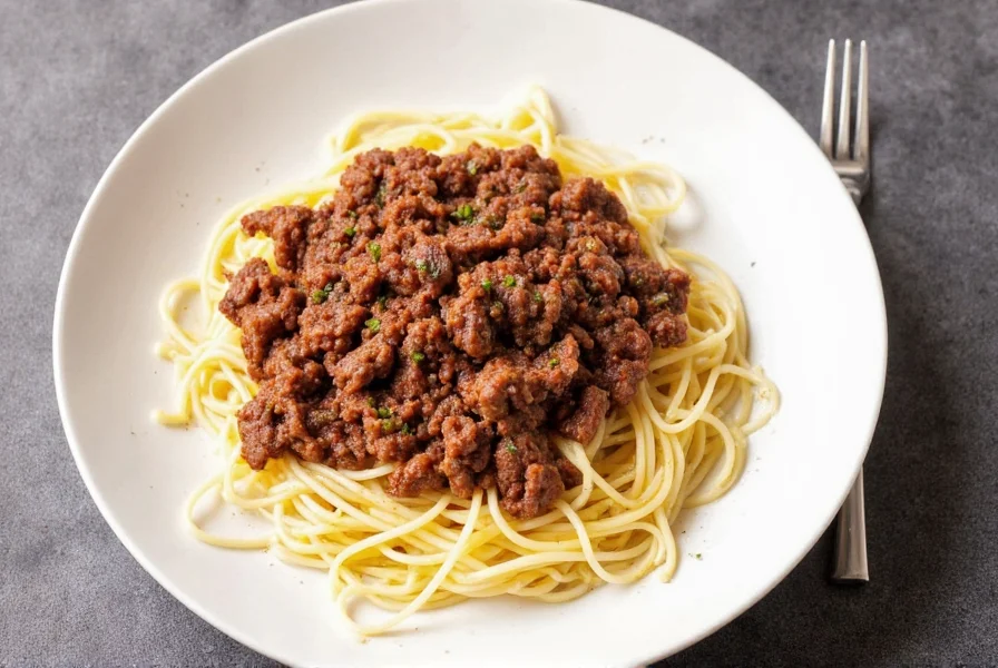 Spaghetti with seasoned beef on a plate