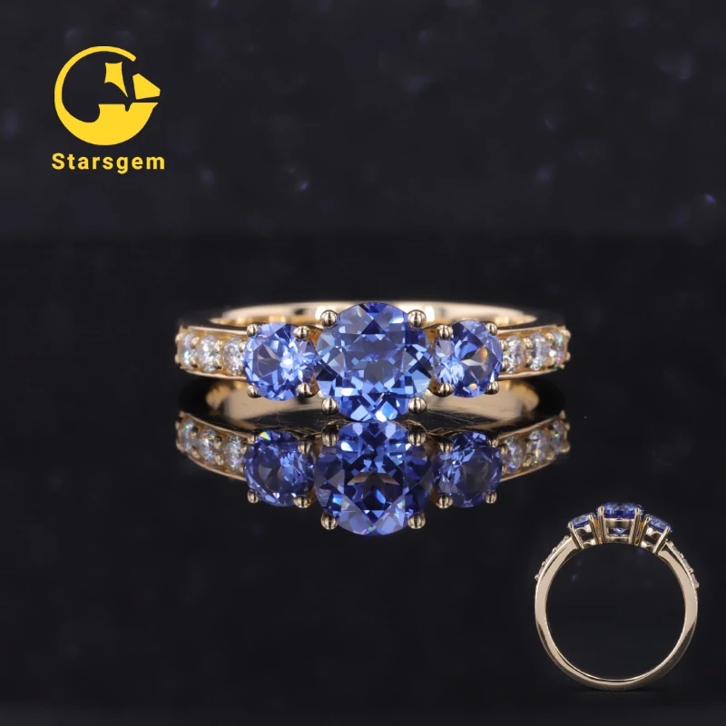 

2023 Light blue sapphire round shape three lab grown sapphire 14 k gold engagement rings for wedding party propose.