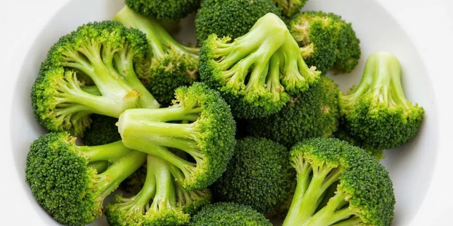 Marinated broccoli on a plate with colorful spices
