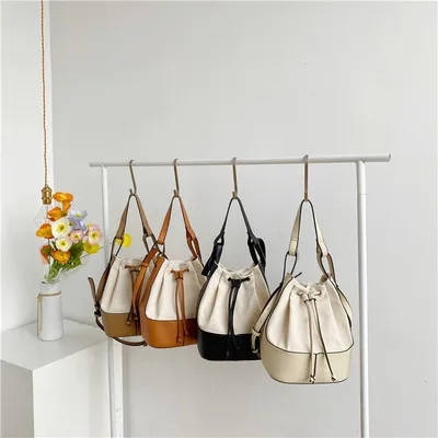 

2021 Designer Korean fashion trend crossbody bag personality spliced canvas handbags bucket bag organizers
