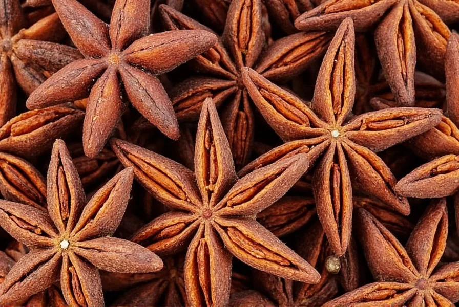 Whole star anise pods arranged on wooden cutting board