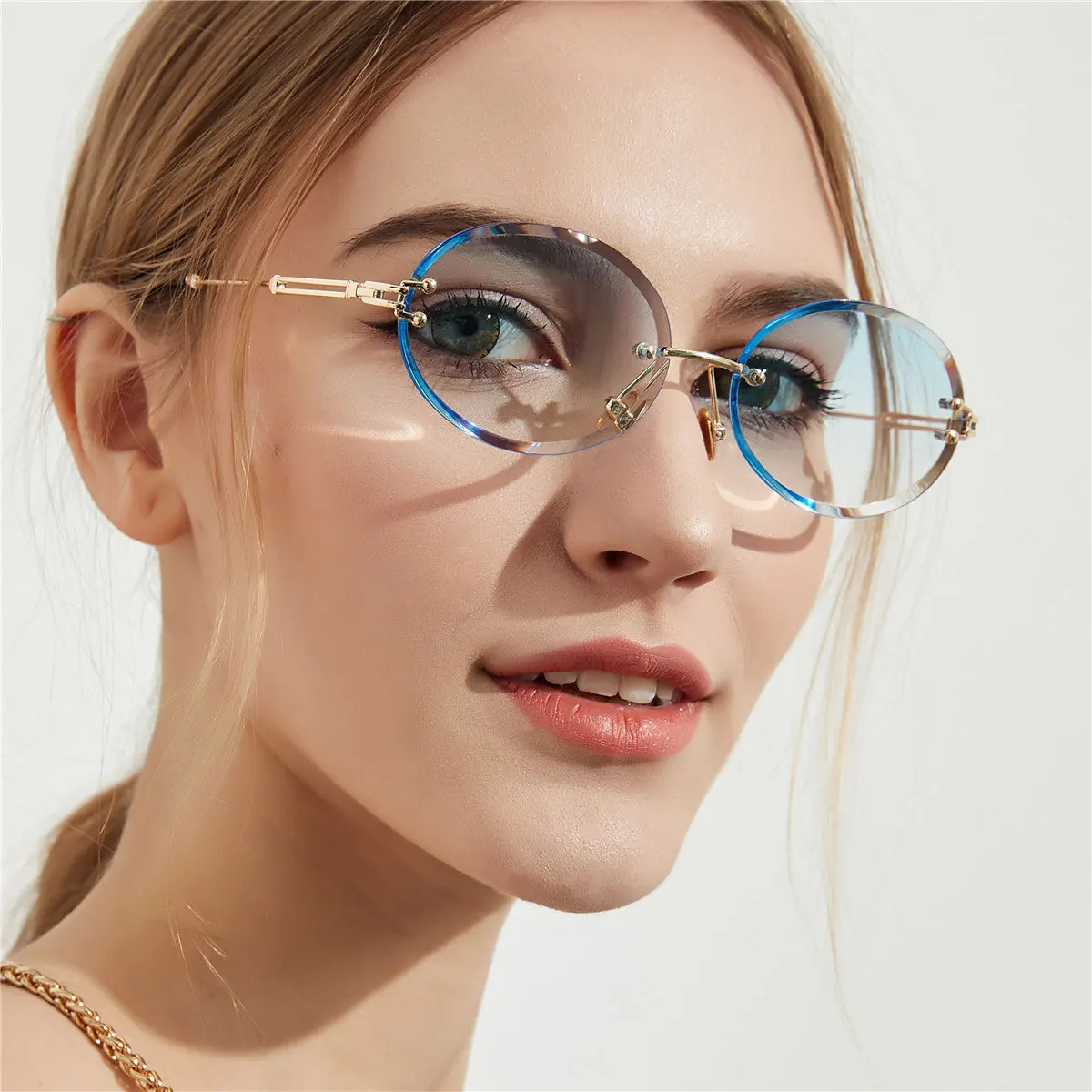 

2021 wholesale rimless trimming Diamond cut clear sunglasses female metal frame oval sunglasses, Picture