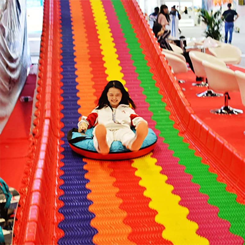 
Funny Outdoor Playground Amusement Games Children Grass Sliding Way Rainbow Dry Snow Slide For Sale 
