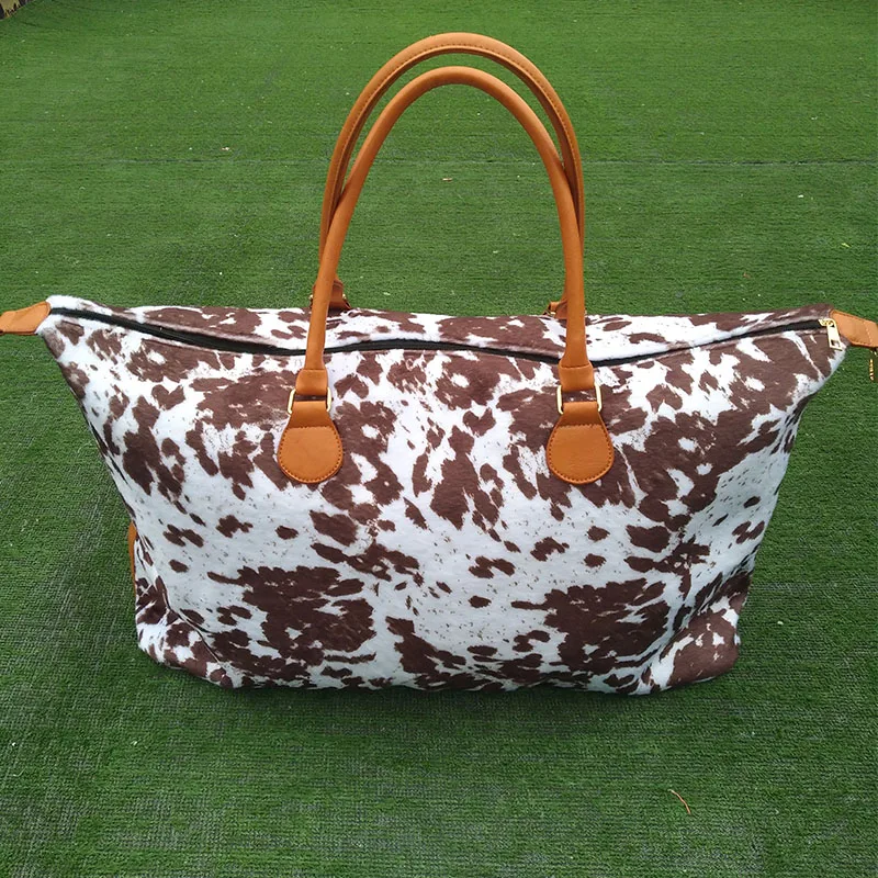 green leather duffle bolsa