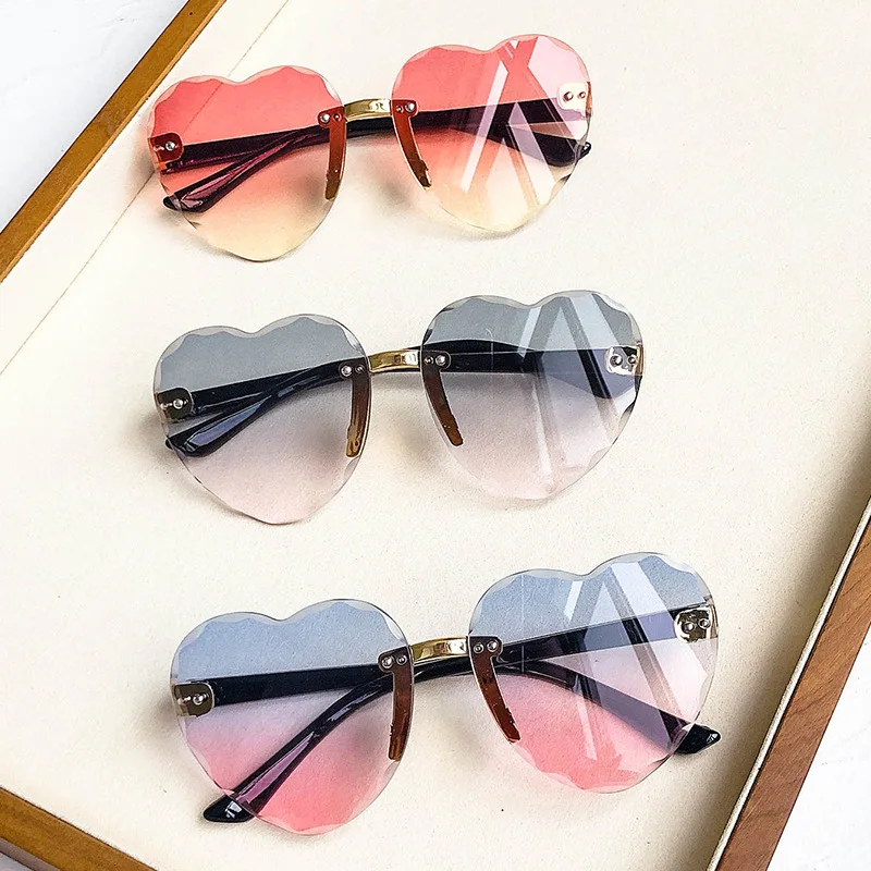 

Children's cut-edge love girls frameless ocean sun glasses gradient peach heart shaped sunglasses, As the pictures show