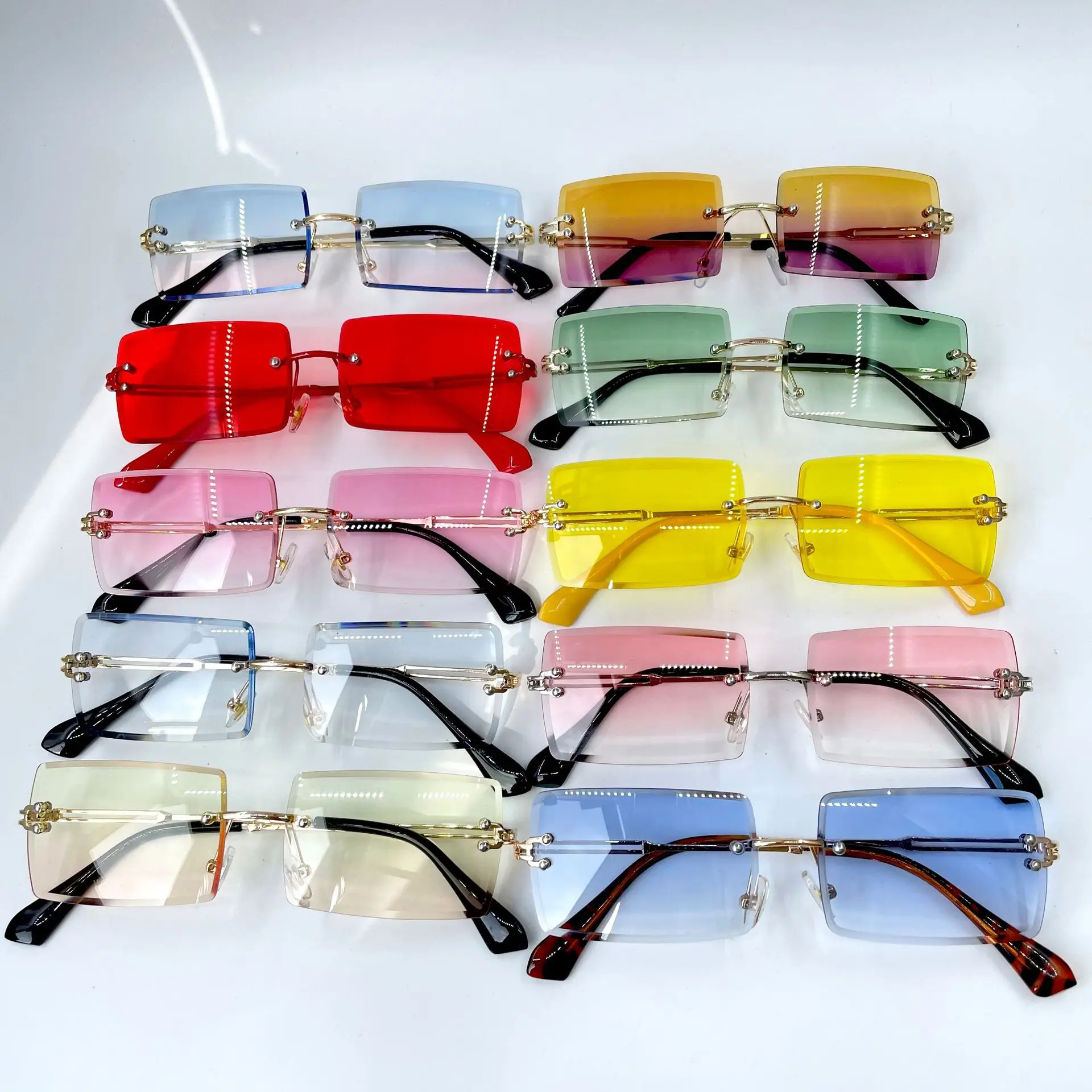 

Jiuling eyewear 2022 Hot Selling Rimless Square Sunglasses Retro Vintage Men Women Small Rectangle Rimless Sunglasses, Mix color or custom colors