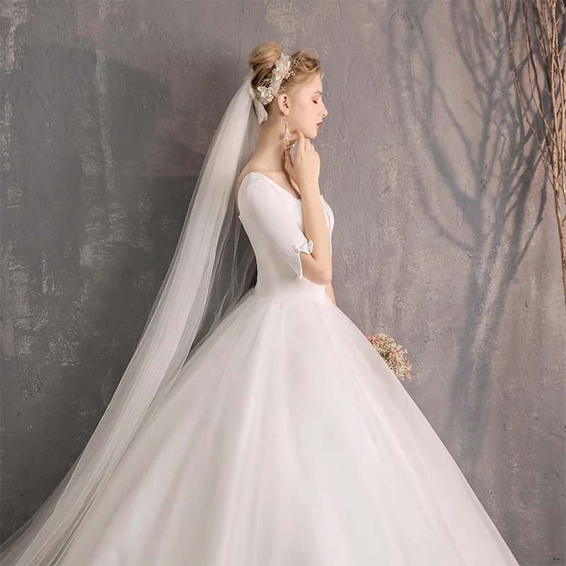 

JKM052 White Satin Luxurious Long Sleeve Ball Gowns