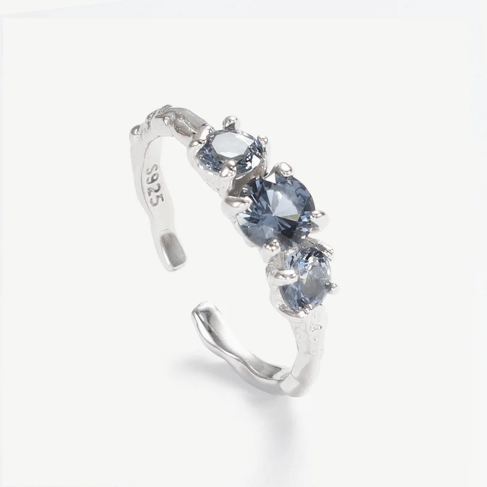 

Chris April In stock 925 sterling silver minimalistic aquamarine cz claw setting organic texture adjustable rings