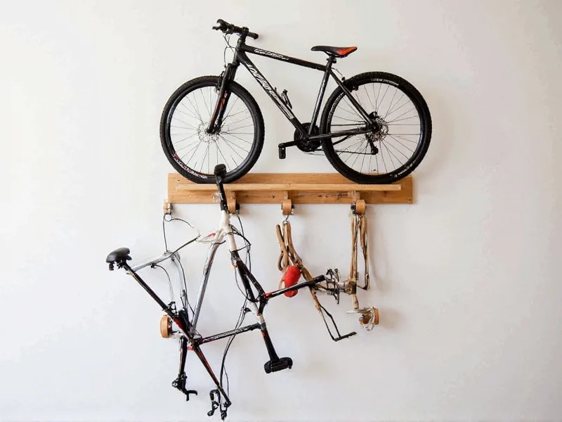 Wall-mounted wooden bike rack holding two bicycles vertically
