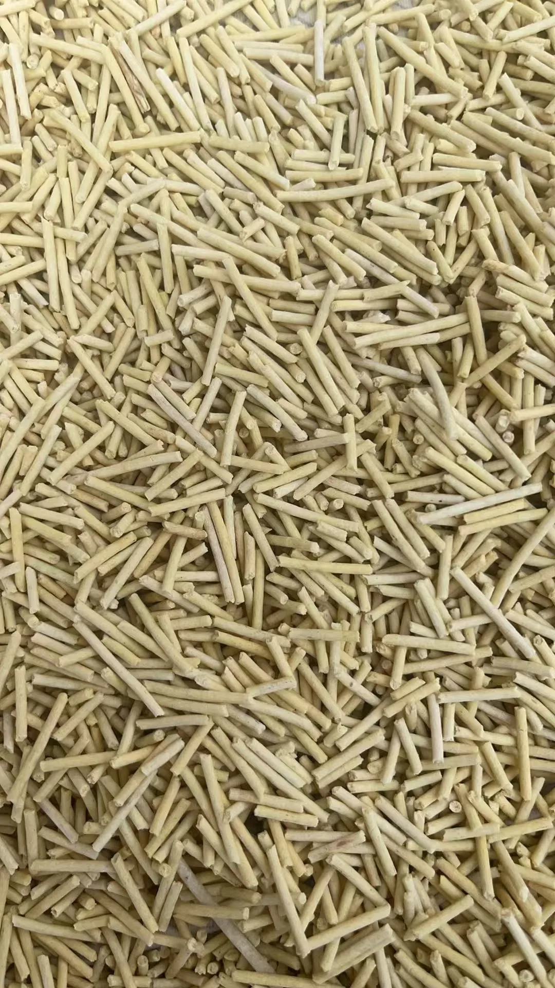Close-up of white tofu litter pellets used as the base for health monitoring granules
