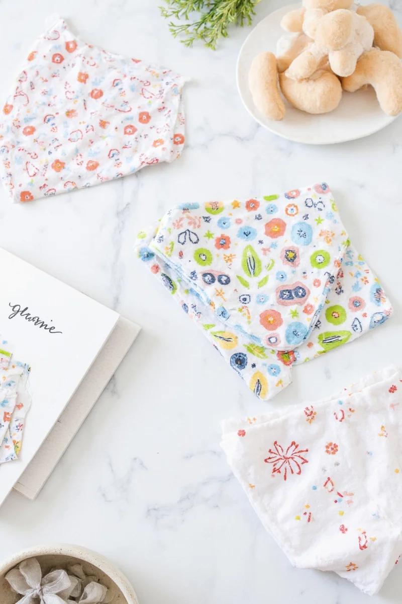 Animal print burp cloths arranged in a basket