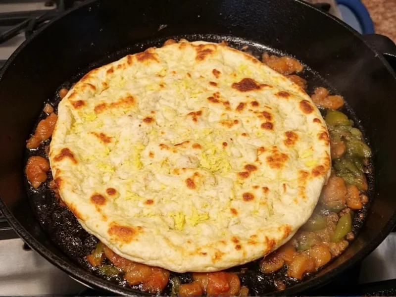Homemade crunchwrap being cooked in cast iron skillet
