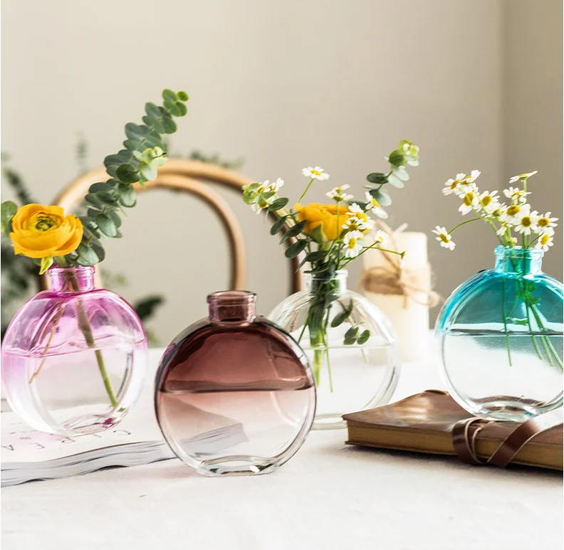 

modern glass colored flower vases and table decorations